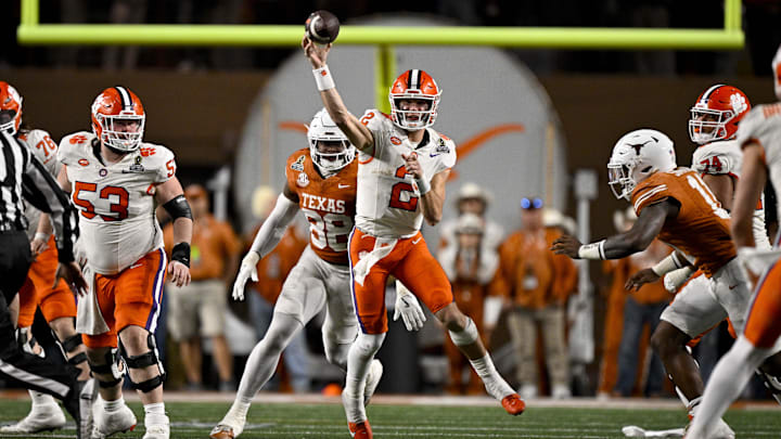Dec 21, 2024; Austin, Texas, USA; Clemson Tigers quarterback Cade Klubnik (2) passes the ball for a first down against the Texas Longhorns during the second half of the CFP National Playoff first round game at Darrell K Royal-Texas Memorial Stadium. Mandatory Credit: Jerome Miron-Imagn Images