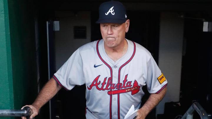 May 24, 2024; Pittsburgh, Pennsylvania, USA;  Atlanta Braves manager Brian Snitker (43) enters the dugout.