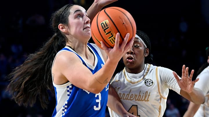 Kentucky guard Georgia Amoore (3) takes the ball to the basket against Vanderbilt guard Madison Greene (4) during an NCAA college basketball game Sunday, Jan. 5, 2025, in Nashville, Tenn. Kentucky guard Georgia Amoore (3) takes the ball to the basket against Vanderbilt guard Madison Greene (4) during an NCAA college basketball game Sunday, Jan. 5, 2025, in Nashville, Tenn.