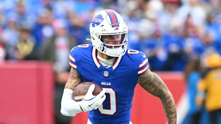 Dec 29, 2024; Orchard Park, New York, USA; Buffalo Bills wide receiver Keon Coleman (0) carries the ball after making a catch in the second quarter against the New York Jets at Highmark Stadium. Mandatory Credit: Mark Konezny-Imagn Images