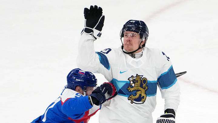 Feb 21, 2026; Milan, Italy; Henri Jokiharju of Finland reaches for the puck against Matus Sukel of Slovakia in the men's ice hockey bronze medal game during the Milano Cortina 2026 Olympic Winter Games at Milano Santagiulia Ice Hockey Arena. Mandatory Credit: James Lang-Imagn Images Feb 21, 2026; Milan, Italy; Henri Jokiharju of Finland reaches for the puck against Matus Sukel of Slovakia in the men's ice hockey bronze medal game during the Milano Cortina 2026 Olympic Winter Games at Milano Santagiulia Ice Hockey Arena. Mandatory Credit: James Lang-Imagn Images
