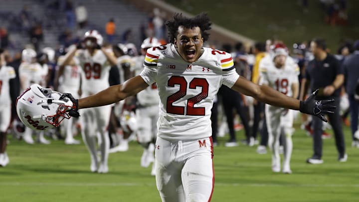 Maryland Terrapins defensive back Jalen Huskey (22) celebrates while running off the field after the game against the Virginia Cavaliers at Scott Stadium.