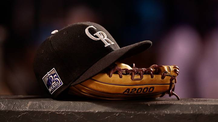 A Colorado Rockies hat and glove. Credit: Isaiah J. Downing-USA TODAY Sports A Colorado Rockies hat and glove. Credit: Isaiah J. Downing-USA TODAY Sports