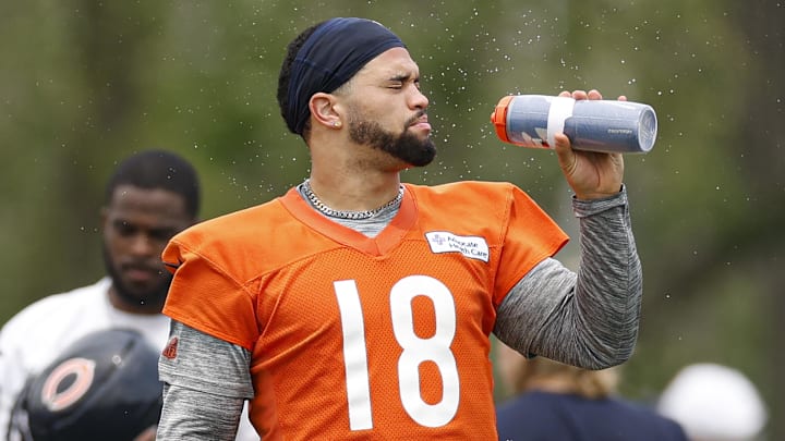 Jun 3, 2025; Lake Forest, IL, USA; Chicago Bears quarterback Caleb Williams (18) cools off during minicamp at Halas Hall. Mandatory Credit: Kamil Krzaczynski-Imagn Images