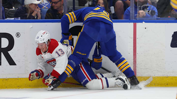 May 6, 2026; Buffalo, New York, USA; Buffalo Sabres center Tage Thompson (72) checks Montréal Canadiens right wing Cole Caufield (13) as he goes after a loose puck during the third period in game one of the second round of the 2026 Stanley Cup Playoffs at KeyBank Center. Mandatory Credit: Timothy T. Ludwig-Imagn Images