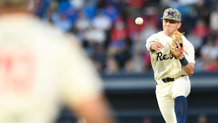 Ole Miss infielder Luke Hill (7) fields, steps on second for an out, and throws to first for a double play in the 2nd inning at Swayze Field in Oxford, Miss., on Friday, Apr. 12, 2024.
