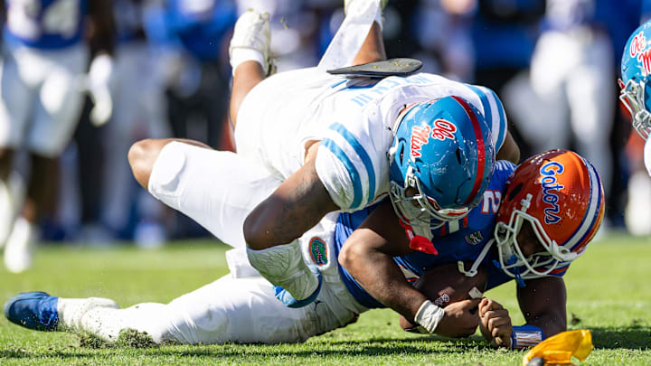 Nov 23, 2024; Gainesville, Florida, USA; Mississippi Rebels defensive tackle Walter Nolen (2) sacks Florida Gators quarterback DJ Lagway (2) during the first half at Ben Hill Griffin Stadium. Mandatory Credit: Matt Pendleton-Imagn Images