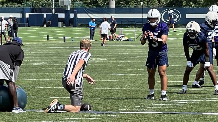 Penn State Nittany Lions quarterback Rocco Becht takes a snap during training camp outside the Lasch Football Building. Penn State Nittany Lions quarterback Rocco Becht takes a snap during training camp outside the Lasch Football Building.
