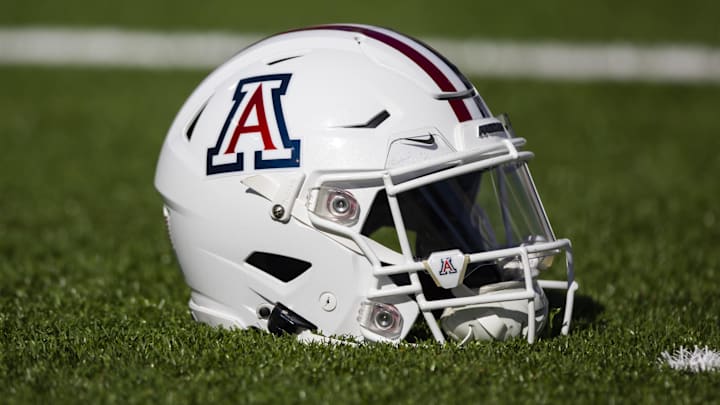 Nov 25, 2022; Tucson, Arizona, USA; Detailed view of an Arizona Wildcats helmet on the field during the Territorial Cup at Arizona Stadium. Mandatory Credit: Mark J. Rebilas-Imagn Images Nov 25, 2022; Tucson, Arizona, USA; Detailed view of an Arizona Wildcats helmet on the field during the Territorial Cup at Arizona Stadium. Mandatory Credit: Mark J. Rebilas-Imagn Images
