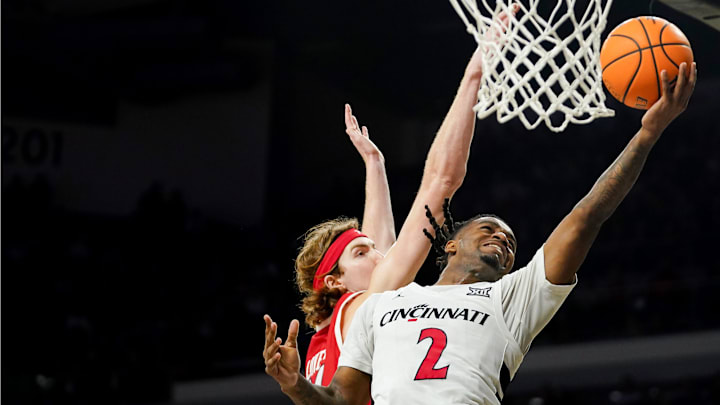 Cincinnati Bearcats guard Jizzle James (2) hits a layup in the second half of a NCAA men’s basketball game between the Cincinnati Bearcats and Utah Utes, Tuesday, Feb. 11, 2025, at Fifth Third Arena in Cincinnati. Bearcats won 85-75.