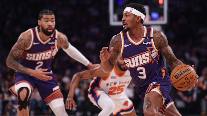 Apr 6, 2025; New York, New York, USA; Phoenix Suns guard Bradley Beal (3) dribbles as New York Knicks forward Mikal Bridges (25) is screened by Phoenix Suns center Nick Richards (2) during the first half at Madison Square Garden. Mandatory Credit: Vincent Carchietta-Imagn Images