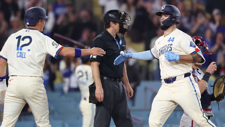 May 9, 2026; Los Angeles, California, USA;  Los Angeles Dodgers center fielder Andy Pages (44) slaps hands with left fielder Alex Call (12) after hitting a two-run home run during the ninth inning against the Atlanta Braves at Dodger Stadium. Mandatory Credit: Kiyoshi Mio-Imagn Images