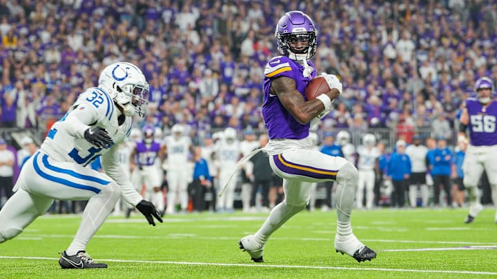 Nov 3, 2024; Minneapolis, Minnesota, USA; Minnesota Vikings wide receiver Jordan Addison (3) catches a pass against the Indianapolis Colts safety Julian Blackmon (32) in the third quarter at U.S. Bank Stadium. Mandatory Credit: Brad Rempel-Imagn Images