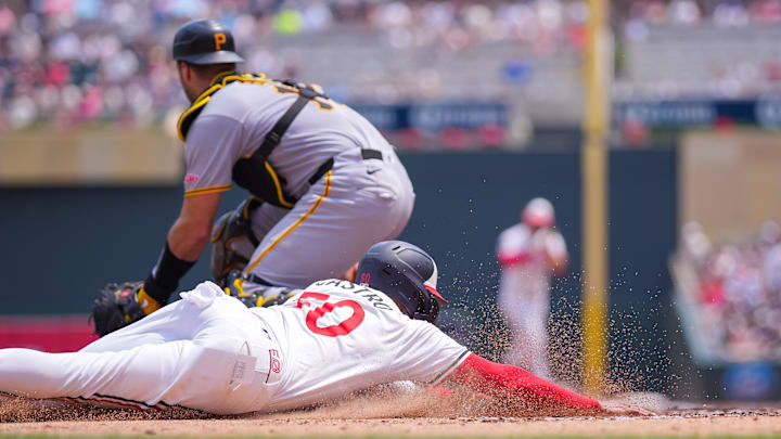 Jul 12, 2025; Minneapolis, Minnesota, USA; Minnesota Twins outfielder Willi Castro (50) slides home against the Pittsburgh Pirates in the second inning at Target Field. Mandatory Credit: Brad Rempel-Imagn Images