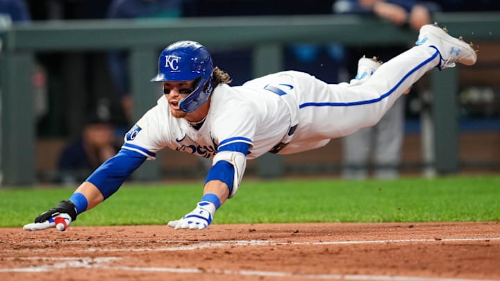 Kansas City Royals shortstop Bobby Witt Jr. (7) dives into home plate.