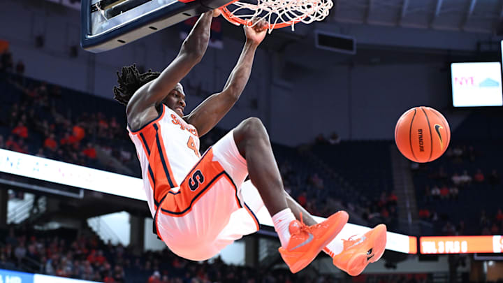 Nov 3, 2025; Syracuse, New York, USA; Syracuse Orange forward William Kyle III (42) dunks the ball in the second half against the Binghamton Bearcats at the JMA Wireless Dome. Mandatory Credit: Mark Konezny-Imagn Images