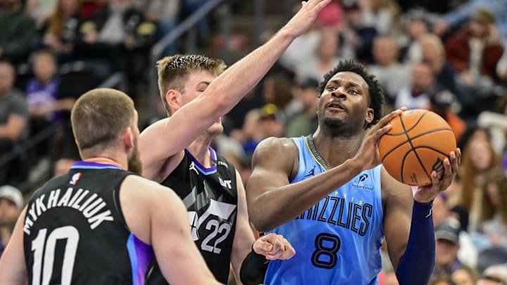 Dec 23, 2025; Salt Lake City, Utah, USA; Memphis Grizzlies forward/center Jaren Jackson Jr. (8) drives to the basket against Utah Jazz center Kyle Filipowski (22) during the first half at Delta Center. Mandatory Credit: Peter Creveling-Imagn Images