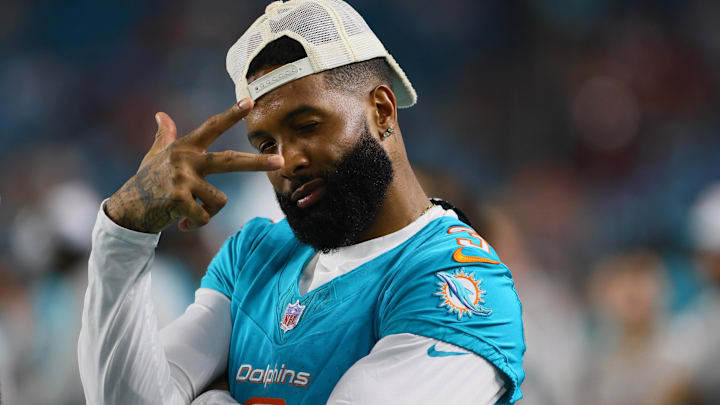 Miami Dolphins wide receiver Odell Beckham Jr. reacts from the sideline against the Washington Commanders