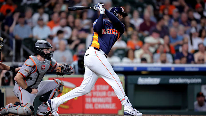 Apr 2, 2025; Houston, Texas, USA; Houston Astros left fielder Yordan Alvarez (44) hits a single to right field against the San Francisco Giants during the third inning at Daikin Park.
