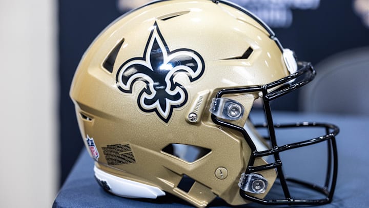 Mar 11, 2023; Metairie, LA, USA; Detailed view of New Orleans Saints helmet at Ochsner Sports Performance Center. Mandatory Credit: Stephen Lew-Imagn Images Mar 11, 2023; Metairie, LA, USA; Detailed view of New Orleans Saints helmet at Ochsner Sports Performance Center. Mandatory Credit: Stephen Lew-Imagn Images