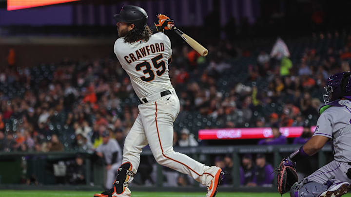 Sep 28, 2022; San Francisco, California, USA; San Francisco Giants shortstop Brandon Crawford (35) hits a sacrifice fly RBI during the first inning against the Colorado Rockies at Oracle Park. 