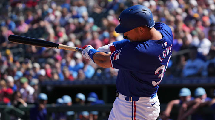 Mar 4, 2024; Surprise, Arizona, USA; Texas Rangers first baseman Nathaniel Lowe (30) bats against