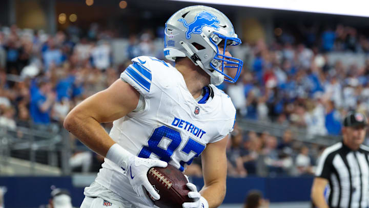 Detroit Lions tight end Sam LaPorta (87) celebrates after scoring a touchdown during the second quarter against the Dallas Cowboys at AT&T Stadium. 