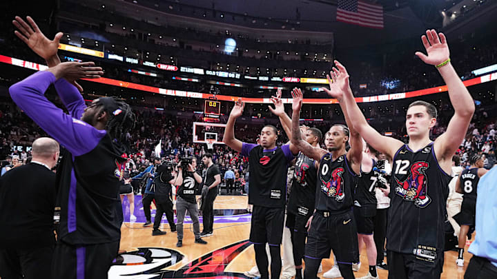 Apr 9, 2025; Toronto, Ontario, CAN; Toronto Raptors forward Scottie Barnes (4) and guard A.J. Lawson (0) acknowledge the crowd after a game against the Charlotte Hornets at Scotiabank Arena. Mandatory Credit: Nick Turchiaro-Imagn Images