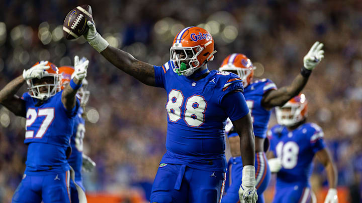 Nov 16, 2024; Gainesville, Florida, USA; Florida Gators defensive lineman Caleb Banks (88) celebrates with the ball after a fumble recovery against the LSU Tigers during the second half at Ben Hill Griffin Stadium. Mandatory Credit: Matt Pendleton-Imagn Images