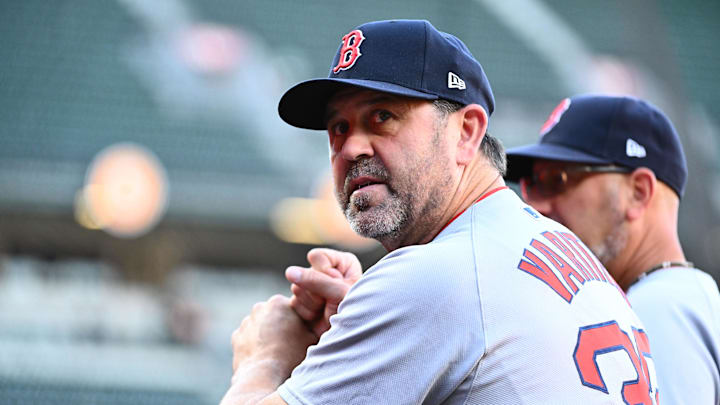 Aug 27, 2025; Baltimore, Maryland, USA;  Boston Red Sox game planning and run prevention coach Jason Varitek (33) stands in the dugout before the game between the Baltimore Orioles and the Boston Red Sox at Oriole Park at Camden Yards. Mandatory Credit: James A. Pittman-Imagn Images
