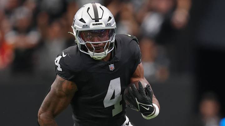 Oct 4, 2026; Paradise, Nevada, USA; Las Vegas Raiders running back Mike Washington Jr. (4) runs with the ball against the Kansas City Chiefs at Allegiant Stadium. Mandatory Credit: David Brytus-Imagn Images