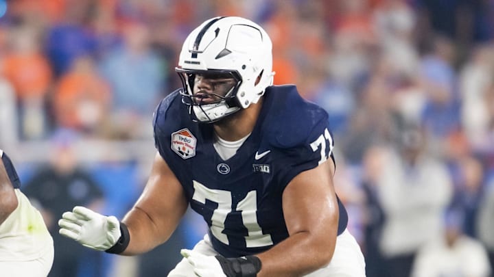 Dec 31, 2024; Glendale, AZ, USA; Penn State Nittany Lions offensive lineman Olaivavega Ioane (71) against the Boise State Broncos during the Fiesta Bowl at State Farm Stadium. Mandatory Credit: Mark J. Rebilas-Imagn Images