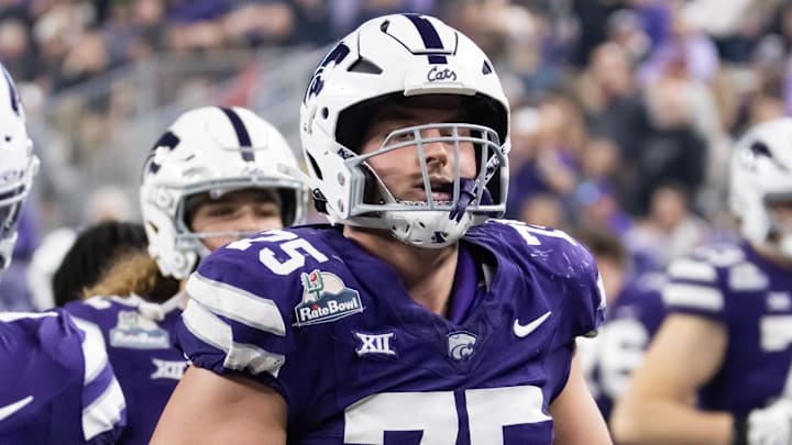 Dec 26, 2024; Phoenix, AZ, USA; Kansas State Wildcats offensive lineman Sam Hecht (75) against the Rutgers Scarlet Knights during the Rate Bowl at Chase Field. Mandatory Credit: Mark J. Rebilas-Imagn Images