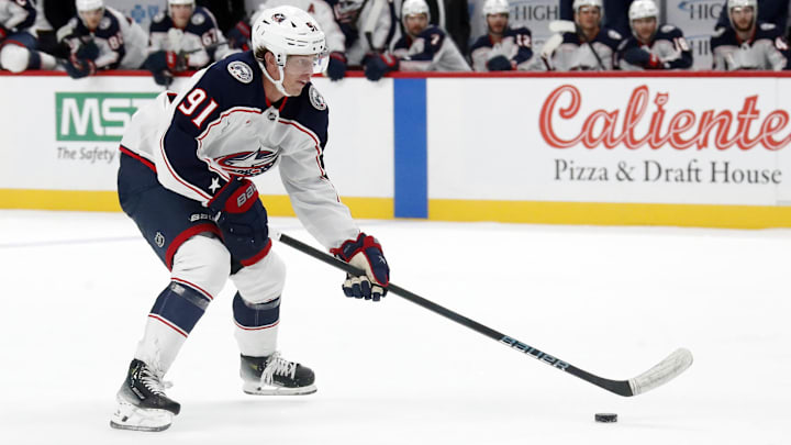 Oct 4, 2024; Pittsburgh, Pennsylvania, USA;  Columbus Blue Jackets center Kent Johnson (91) skates with the puck on a breakaway against the Pittsburgh Penguins during the second period at PPG Paints Arena. Mandatory Credit: Charles LeClaire-Imagn Images
