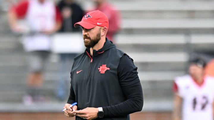 Sep 6, 2025; Pullman, Washington, USA; San Diego State Aztecs head coach Sean Lewis looks on before a game against the Washington State Cougars at Gesa Field at Martin Stadium. Mandatory Credit: James Snook-Imagn Images Sep 6, 2025; Pullman, Washington, USA; San Diego State Aztecs head coach Sean Lewis looks on before a game against the Washington State Cougars at Gesa Field at Martin Stadium. Mandatory Credit: James Snook-Imagn Images