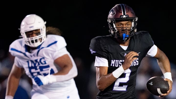 Lipscomb's Deuce Knight (2) runs away from IMG's Jayden Jackson(65) at Lipscomb's Reese Smith Football Field in Nashville, Tenn., Friday night, Aug. 18, 2023.