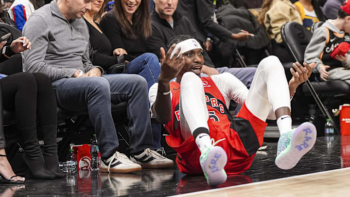 Jan 25, 2025; Atlanta, Georgia, USA; Toronto Raptors forward Chris Boucher (25) reacts after being fouled while shooting against the Atlanta Hawks during the second half at State Farm Arena. Mandatory Credit: Dale Zanine-Imagn Images