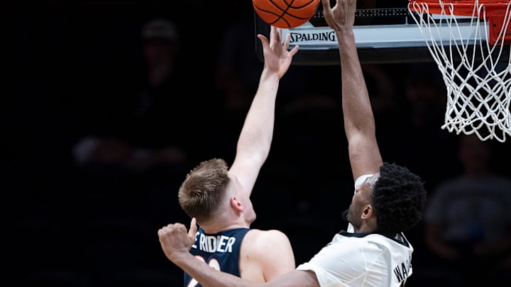 Virginia forward Thijs De Ridder (28) has his shot blocked by Vanderbilt center Jalen Washington (13) during the second half of their exhibition game at Memorial Gym in Nashville, Tenn., Thursday, Oct. 16, 2025.