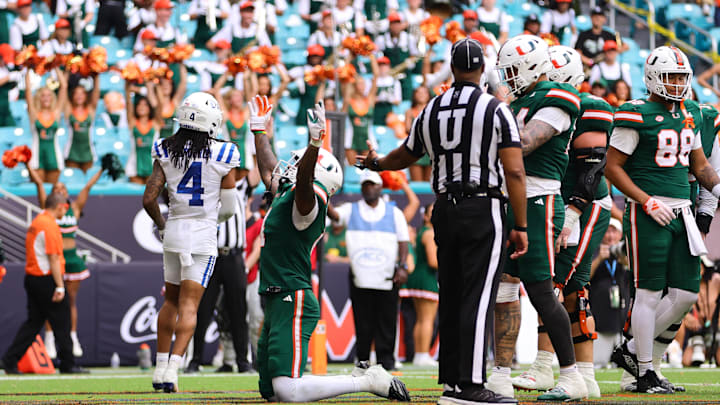 Nov 2, 2024; Miami Gardens, Florida, USA; Miami Hurricanes running back Mark Fletcher Jr. (4) celebrates after scoring a touchdown against the Duke Blue Devils during the fourth quarter at Hard Rock Stadium. Mandatory Credit: Sam Navarro-Imagn Images