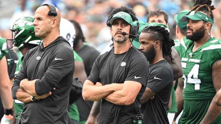 Aug 12, 2023; Charlotte, North Carolina, USA; New York Jets quarterback Aaron Rodgers (8) behind Robert Saleh on the sidelines in the third quarter at Bank of America Stadium