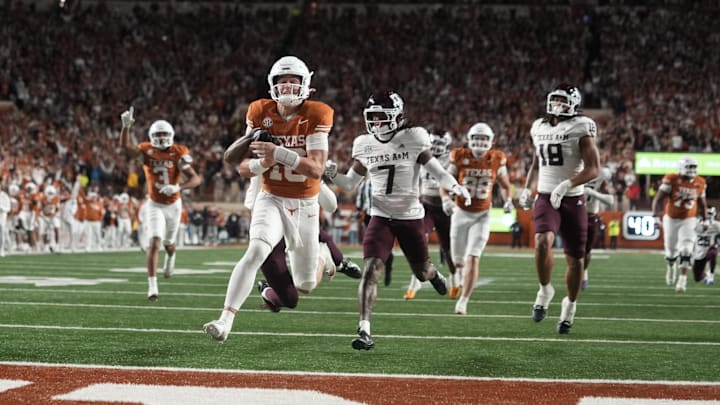 Nov 28, 2025; Austin, Texas, USA; Texas Longhorns quarterback Arch Manning keeps the ball and runs for a touchdown against the Texas A&M Aggies at Darrell K Royal-Texas Memorial Stadium. Nov 28, 2025; Austin, Texas, USA; Texas Longhorns quarterback Arch Manning keeps the ball and runs for a touchdown against the Texas A&M Aggies at Darrell K Royal-Texas Memorial Stadium.