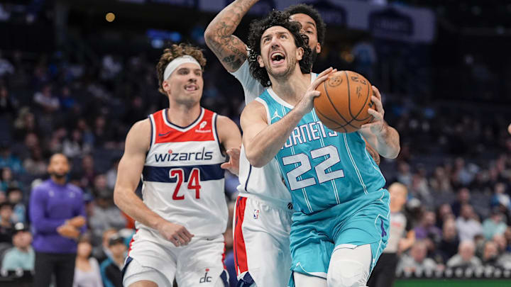 Feb 3, 2025; Charlotte, North Carolina, USA; Charlotte Hornets guard Vasilije Micic (22) goes to the basket chased by Washington Wizards forward Justin Champagnie (9) during the first half at Spectrum Center. Mandatory Credit: Jim Dedmon-Imagn Images Feb 3, 2025; Charlotte, North Carolina, USA; Charlotte Hornets guard Vasilije Micic (22) goes to the basket chased by Washington Wizards forward Justin Champagnie (9) during the first half at Spectrum Center. Mandatory Credit: Jim Dedmon-Imagn Images