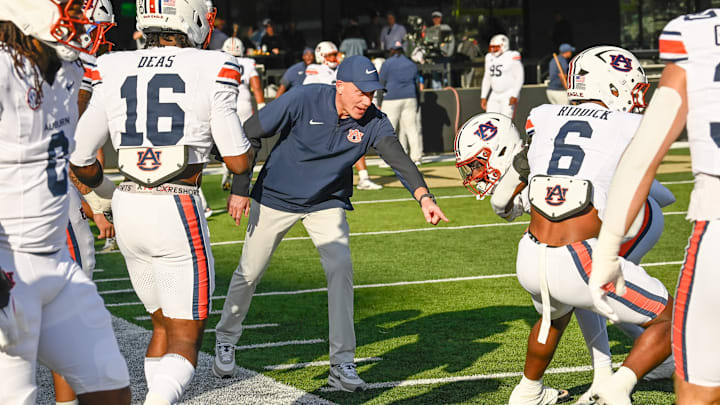 Auburn interim coach DJ Durkin runs drills before the game against Vanderbilt at FirstBank Stadium in Nashville, Tenn., Saturday, Nov. 8, 2025.