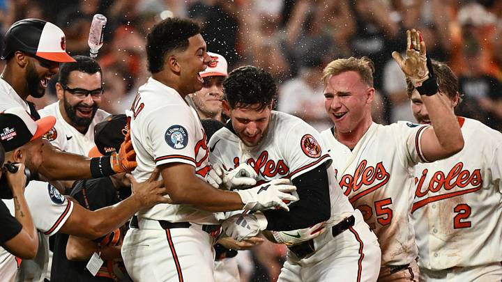 Aug 22, 2026; Baltimore, Maryland, USA;  Baltimore Orioles right fielder Dylan Beavers (12) and teammates celebrate a win against the Tampa Bay Rays at Oriole Park at Camden Yards.  Mandatory Credit: James A. Pittman-Imagn Images