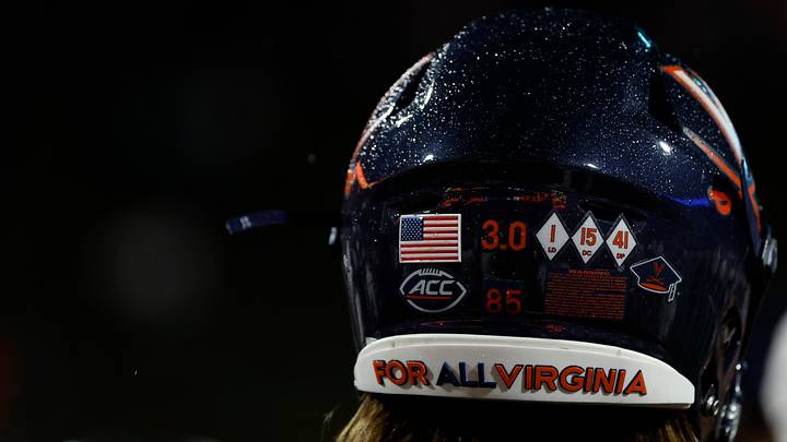 Sep 22, 2023; Charlottesville, Virginia, USA; A view of decals honoring the lives of three Virginia Cavaliers players killed in a campus shooting last season on the helmet of Cavaliers tight end Grant Misch (85) after the game against the North Carolina State Wolfpack at Scott Stadium. Mandatory Credit: Geoff Burke-USA TODAY Sports Sep 22, 2023; Charlottesville, Virginia, USA; A view of decals honoring the lives of three Virginia Cavaliers players killed in a campus shooting last season on the helmet of Cavaliers tight end Grant Misch (85) after the game against the North Carolina State Wolfpack at Scott Stadium. Mandatory Credit: Geoff Burke-USA TODAY Sports