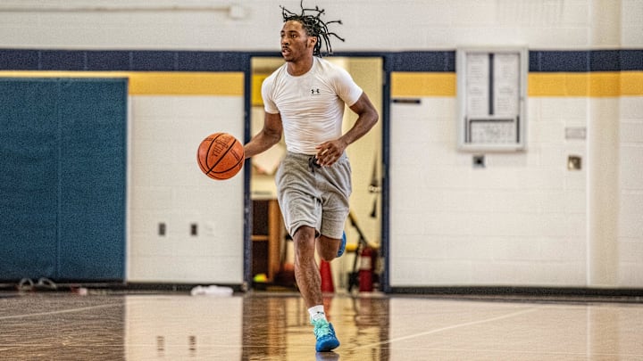 Wayne Memorial's Carlos Medlock Jr. brings the ball up the floor during a boys basketball open gym on Wednesday, July 31, 2024.