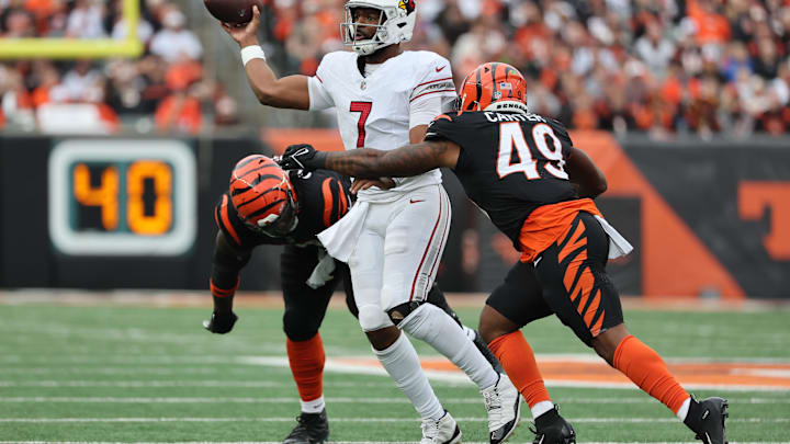 Dec 28, 2025; Cincinnati, Ohio, USA; Arizona Cardinals quarterback Jacoby Brissett (7) throws against Cincinnati Bengals linebacker Barrett Carter (49) during the second half at Paycor Stadium. Mandatory Credit: Joseph Maiorana-Imagn Images