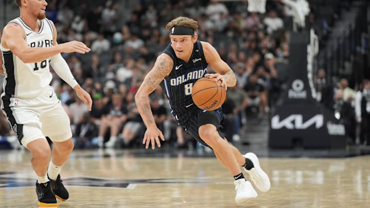 Orlando Magic guard Mac McClung (8) dribbles past San Antonio Spurs guard Malachi Flynn (18) in the second half at Frost Bank Center.