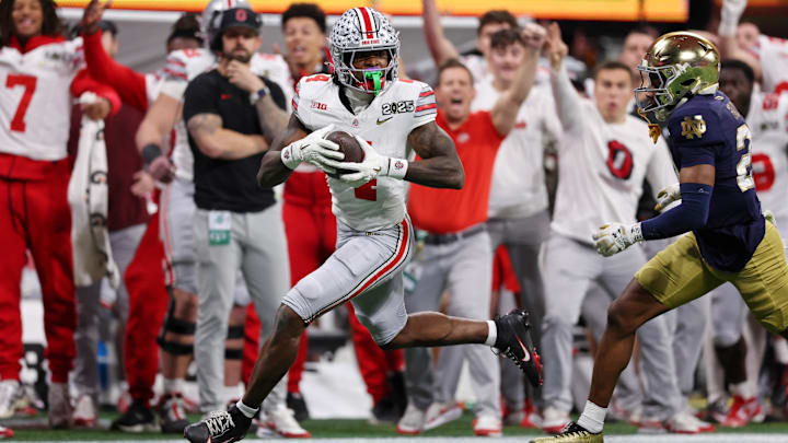 Jan 20, 2025; Atlanta, GA, USA; Ohio State Buckeyes wide receiver Jeremiah Smith (4) makes a catch against the Notre Dame Fighting Irish during the second half of the CFP National Championship college football game at Mercedes-Benz Stadium. Mandatory Credit: Brett Davis-Imagn Images Jan 20, 2025; Atlanta, GA, USA; Ohio State Buckeyes wide receiver Jeremiah Smith (4) makes a catch against the Notre Dame Fighting Irish during the second half of the CFP National Championship college football game at Mercedes-Benz Stadium. Mandatory Credit: Brett Davis-Imagn Images