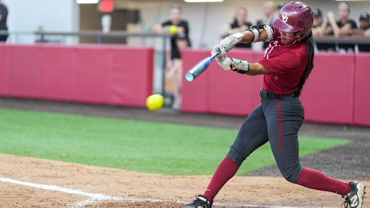 Senior second baseman Ailana Agbayani hits a single during a fall exhibition game against Oklahoma Christian University at Love’s Field on Wednesday, Oct. 15, in Norman, Okla.